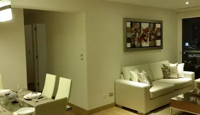 a living room with a couch and a table at Peru Rent Apart com pe in Lima