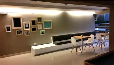 a living room with a couch and a table and chairs at Peru Rent Apart com pe in Lima