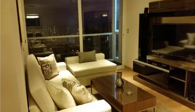 a living room with a white couch and a large window at Peru Rent Apart com pe in Lima
