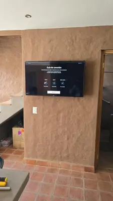 a flat screen tv on a wall in a room at Casa Catahuasi , Sacred Valley ,Urubamba,Cusco, Peru in Urubamba