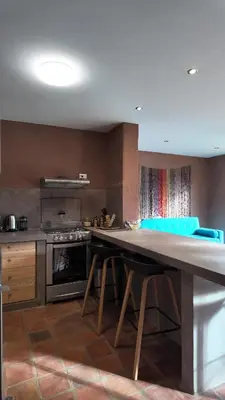 a kitchen with a large wooden table in a room at Casa Catahuasi , Sacred Valley ,Urubamba,Cusco, Peru in Urubamba