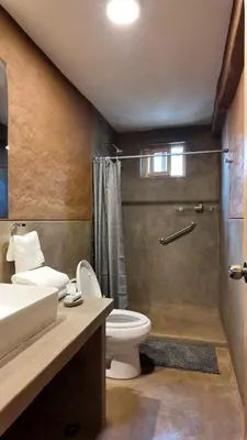 a bathroom with a toilet and a sink and a shower at Casa Catahuasi , Sacred Valley ,Urubamba,Cusco, Peru in Urubamba