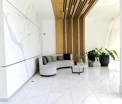 a living room with a couch and a map on the wall at Departamento en Santa Catalina cerca a San Isidro in Lima