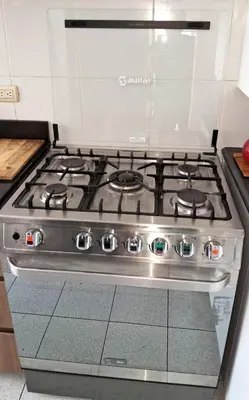 a stove top oven sitting in a kitchen at El Derby 511 Aparts de 3 Dorm con Aire Acondicionado in Lima