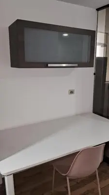 a white desk with two chairs and a microwave at El Derby 511 Aparts de 3 Dorm con Aire Acondicionado in Lima