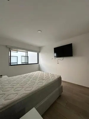 a bedroom with a bed and a flat screen tv at molero in Lima