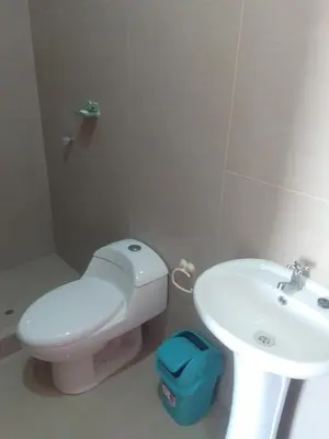 a bathroom with a white toilet and a sink at Casa, Playa el pasamayito sur de asia in Asia