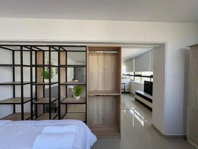 a bedroom with a bed and a living room at Apartment in Lima in Lima