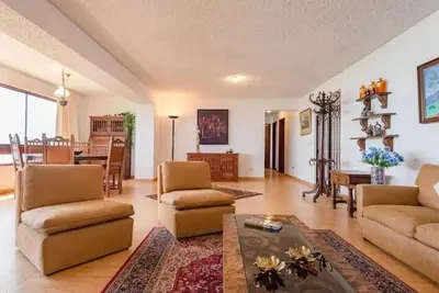 a living room with a couch and chairs and a table at M701 Malecón View Apartment 3 BDR in Lima
