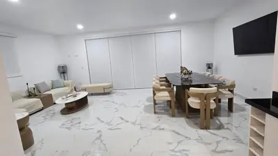 a living room with a table and a couch at Casa de Playa de Estreno in Cerro Azul