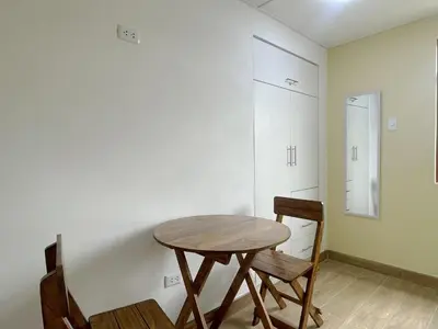a dining room with a table and two chairs at La Casa del Valle - Huaripampa in Huaripampa