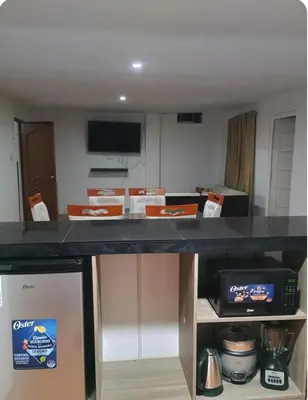 a kitchen with a counter with boxes on it at Departamento Acogedor en Surco in Lima
