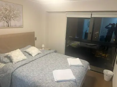 a bedroom with a bed with two towels on it at Luxury Aparment in San Isidro in Lima