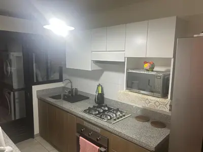 a kitchen with a sink and a microwave at Luxury Aparment in San Isidro in Lima