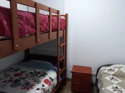 a couple of bunk beds in a room at Apartment Rosi Beach & Pool Punta Hermosa in Punta Hermosa