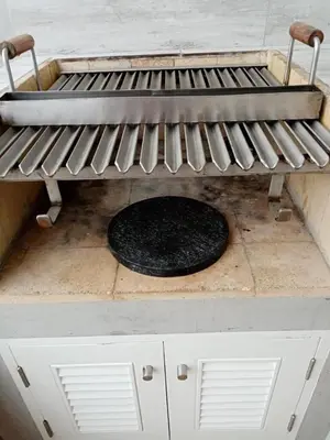 a grill sitting on top of a table at Apartment Rosi Beach & Pool Punta Hermosa in Punta Hermosa