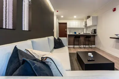 a living room with a couch and a table at Artline by Geko in Lima