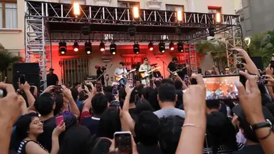 a crowd of people taking pictures of a band on a stage at Chelovirock- Luxury Penthouse Great Location in Lima