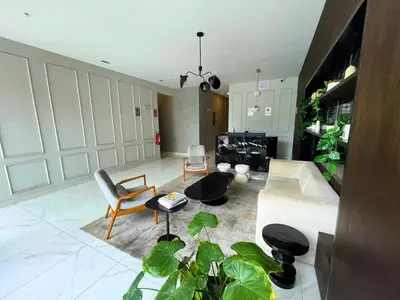 a living room with a couch and chairs and plants at Chelovirock- Luxury Penthouse Great Location in Lima