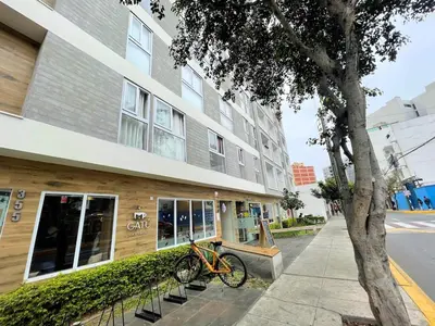 a bike parked in front of a building at Chelovirock- Luxury Penthouse Great Location in Lima