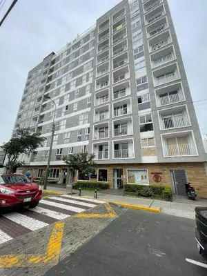 a large apartment building on the corner of a street at Chelovirock- Luxury Penthouse Great Location in Lima
