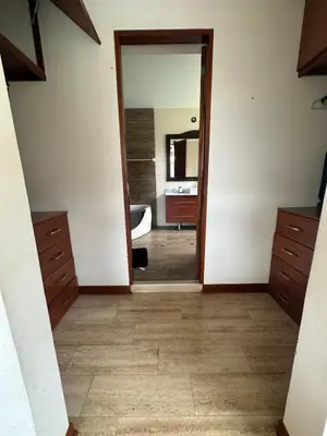 a room with a bathroom with a mirror and a sink at Casa campo en Cieneguilla 2,040m2 in Pachacamac