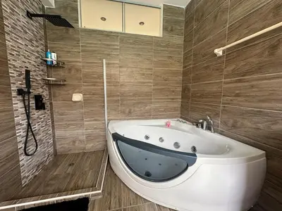 a bathroom with a tub with a whale head on it at Casa campo en Cieneguilla 2,040m2 in Pachacamac