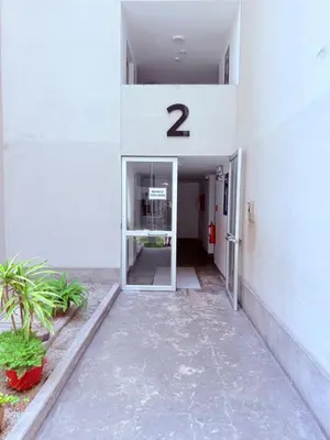a hallway of a building with a door with the number two at Acogedor Departamento en Lima in Lima