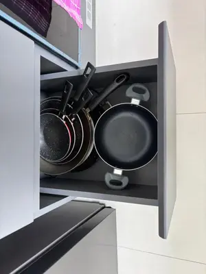 a cabinet with pots and pans in a kitchen at Dormitorio con baño en departamento Miraflores in Lima