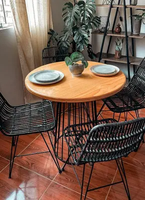 a wooden table with chairs and plates on it at House Sacha 1BR Great View Huanuco in Huánuco