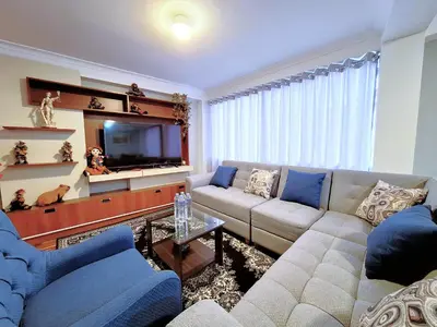 a living room with a couch and a tv at Jerusalen Inn -Dep 1 in Cusco