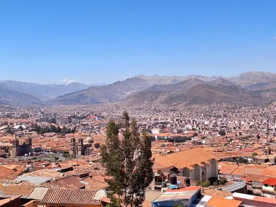 a view of a city with mountains in the background at Jerusalen Inn -Dep 1 in Cusco