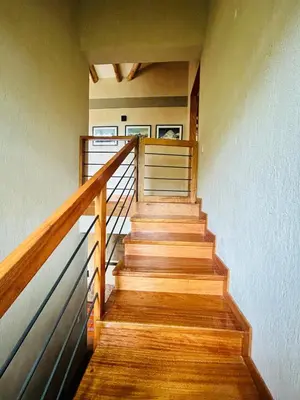 a staircase in a house with wooden steps at Luxury house in Urubamba, Cusco, Perú in Urubamba
