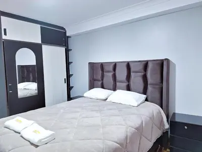 a bedroom with a large bed with two white pillows at Jerusalen Inn-Dep 3 in Cusco