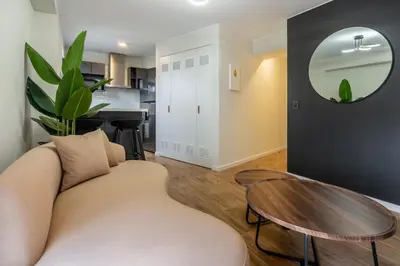 a living room with a couch and a table at Canaval y Moreyra by Geko in Lima