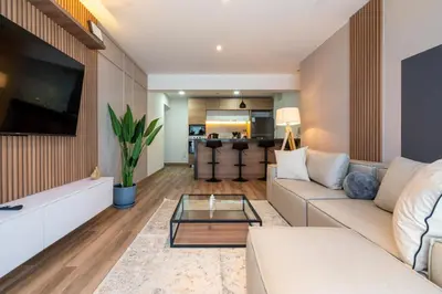 a living room with a couch and a table at Eco 28 by Geko in Lima