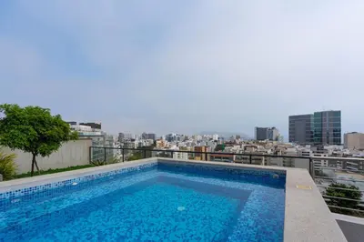 a swimming pool on the roof of a building at Eco 28 by Geko in Lima