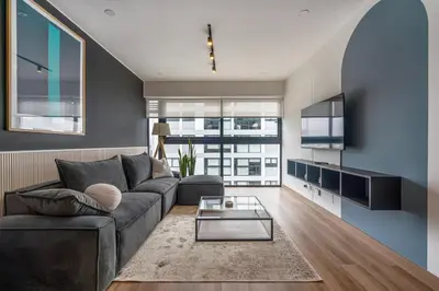 a living room with a couch and a table at Eco 28 by Geko in Lima