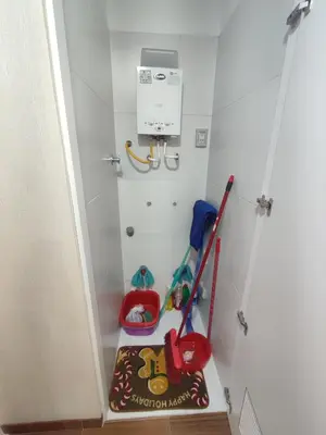 a small childs play room with a broom and toys at Depa moderno - Aeropuerto, San Marcos, Católica in Lima