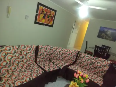 a living room with a couch and a picture on the wall at Angelica's House Apartments in Lima