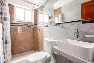 a bathroom with a toilet and a sink and a shower at Apartamento en Cuzco in Cusco