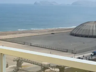 a view of a building on the beach at DEPARTAMENTO FRENTE ARENa 1 in Lima