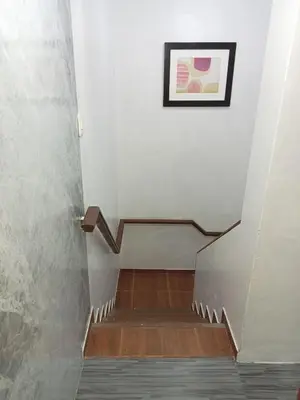 a stairway with a picture on the wall at Habitación cama QUEEN 1B in Lima