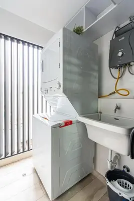 a white bathroom with a sink and a sink at Gardenia by Geko in Lima