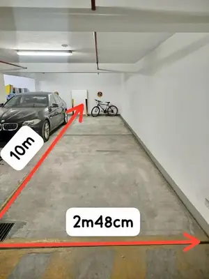 a garage with a car parked in the middle of it at Malecón Miraflores Luxury Penthouse in Lima