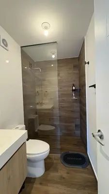a bathroom with a toilet and a sink and a shower at Apartment 2BDR next to Javier Prado - San Isidro in Lima