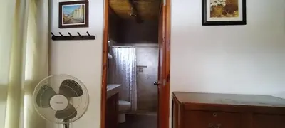 a bathroom with a fan next to a door at Bungalow 23 in El Carmen