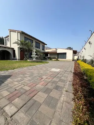 a stone driveway in front of a house at casa Alva in La Molina