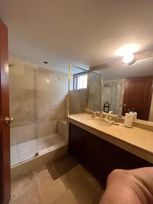 a bathroom with a shower and a sink and a mirror at casa Alva in La Molina