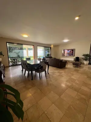 a large living room with a table and a couch at casa Alva in La Molina